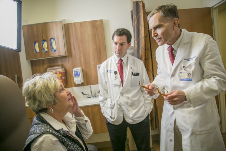 doctors speaking with a brain tumor patient who looks concerned
