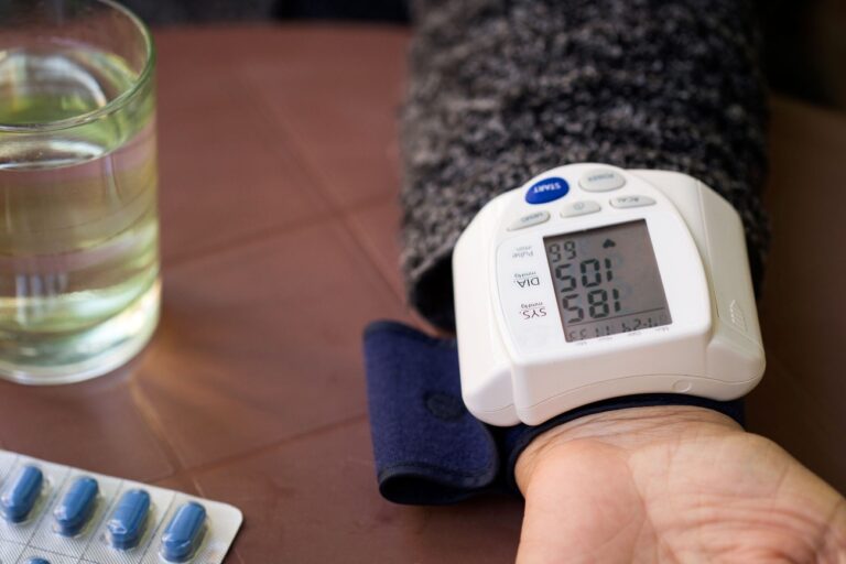 a digital blood pressure cuff on a person's wrist