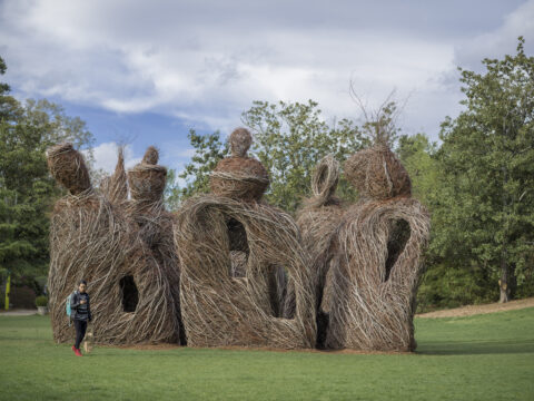 whimsical stickwork sculpture using sticks that have been woven together